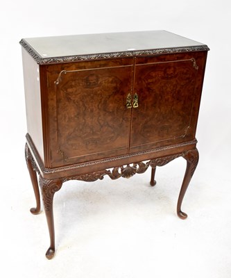 Lot 65 - A reproduction burr walnut cocktail cabinet...