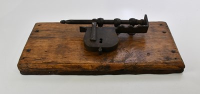 Lot 379 - An 18th century iron lock, mounted on wooden...