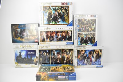 Lot 314 - HARRY POTTER; seven jigsaws of various sizes,...