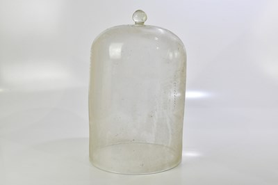 Lot 357 - A large glass dome, height 43cm.