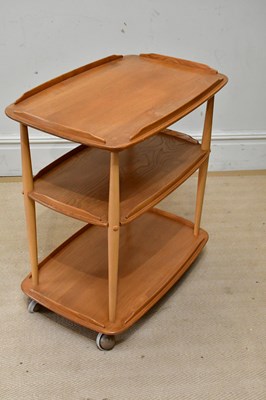 Lot 57 - ERCOL; a light elm three tier trolley, height...