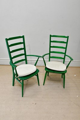 Lot 61 - ERCOL; a pair of green painted ladderback...