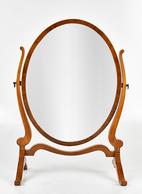 Lot 36 - A modern yew wood oval swing toilet mirror.