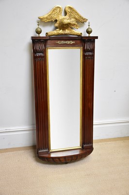 Lot 224 - An Empire style wall mirror with bird surmount,...