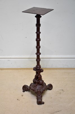 Lot 220 - A cast iron brown painted tripod torchere...