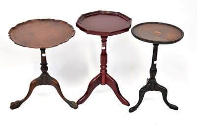 Lot 36 - Three side tables, all on turned columns to...