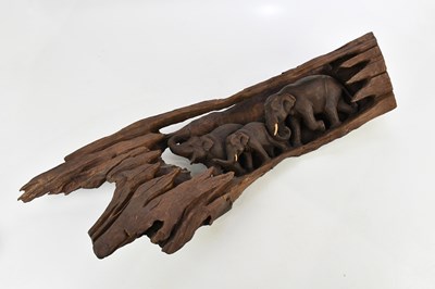 Lot 1248 - A carved wooden wall hanging of three...