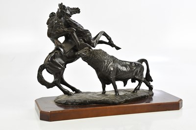 Lot 1391 - A resin sculpture of a bull and matador on...