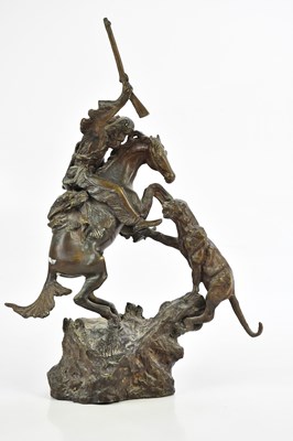 Lot 1373 - A bronze figure group of a mountain man on...