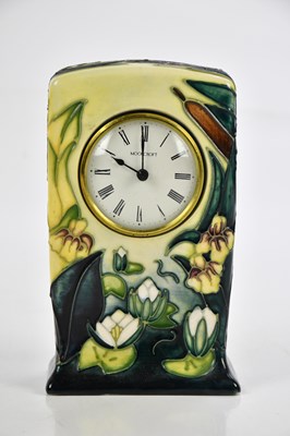 Lot 86 - MOORCROFT; a 'Lamia' pattern mantel clock,...