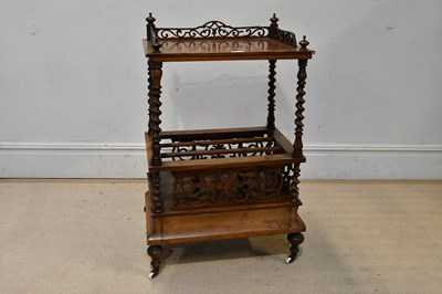 Lot 162 - An Edwardian walnut Canterbury with single...