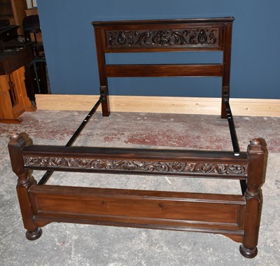 Lot 2906 - An Edwardian carved mahogany double bedstead,...