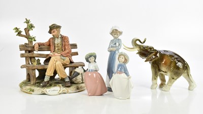 Lot 462 - A small group of ceramic figures comprising a...