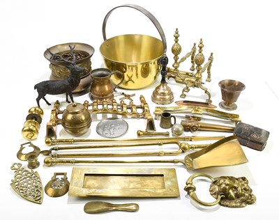 Lot 287 - A three piece brass companion set, longest...