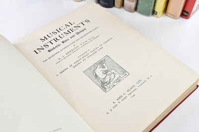 Lot 337 - A collection of books on cameras, musical...