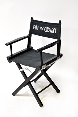 Lot 226 - PAUL MCCARTNEY; a black director's chair with...