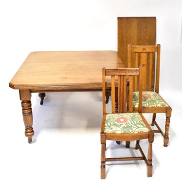 Lot 24 - A Victorian oak wind-out dining table, with...