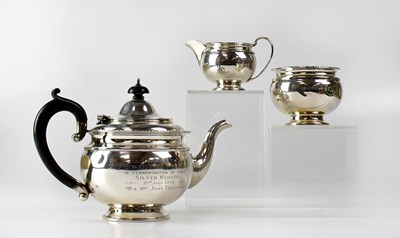 Lot 696 - A George V hallmarked silver three-piece tea...