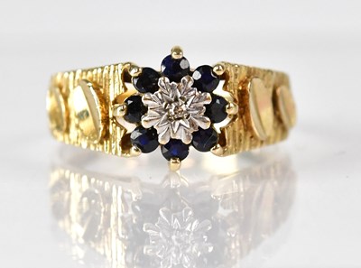 Lot 788 - A 9ct yellow gold diamond and sapphire floral...