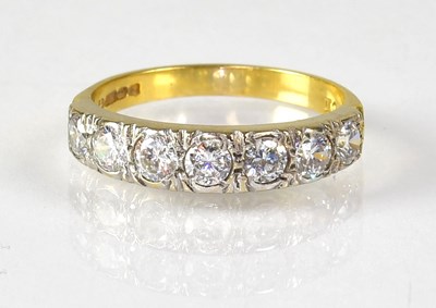 Lot 785 - An 18ct yellow gold seven stone diamond ring,...