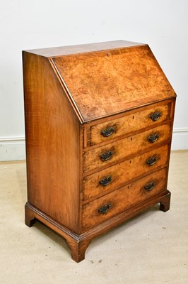 Lot 113 - A reproduction walnut bureau, with fall above...