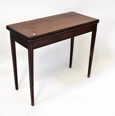 Lot 9 - A Georgian mahogany fold-over tea table on...