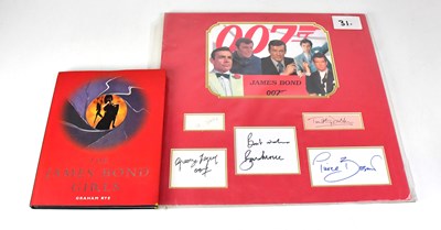 Lot 347 - JAMES BOND; five mounted autographs comprising...