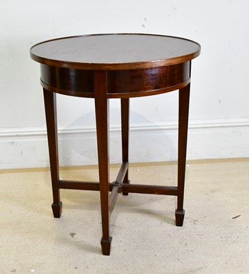 Lot 216 - A mahogany circular table on square tapering...