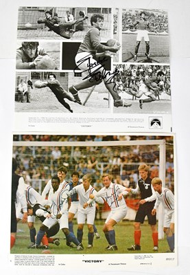 Lot 333 - VICTORY; a colour still of the film signed by...