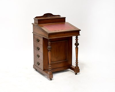 Lot 87 - A 19th century mahogany Davenport with top...