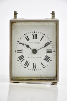 Lot 353 - WILLIAMS & CO; a travelling clock with white...