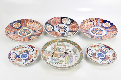 Lot 1037 - A collection of four Imari pattern chargers,...