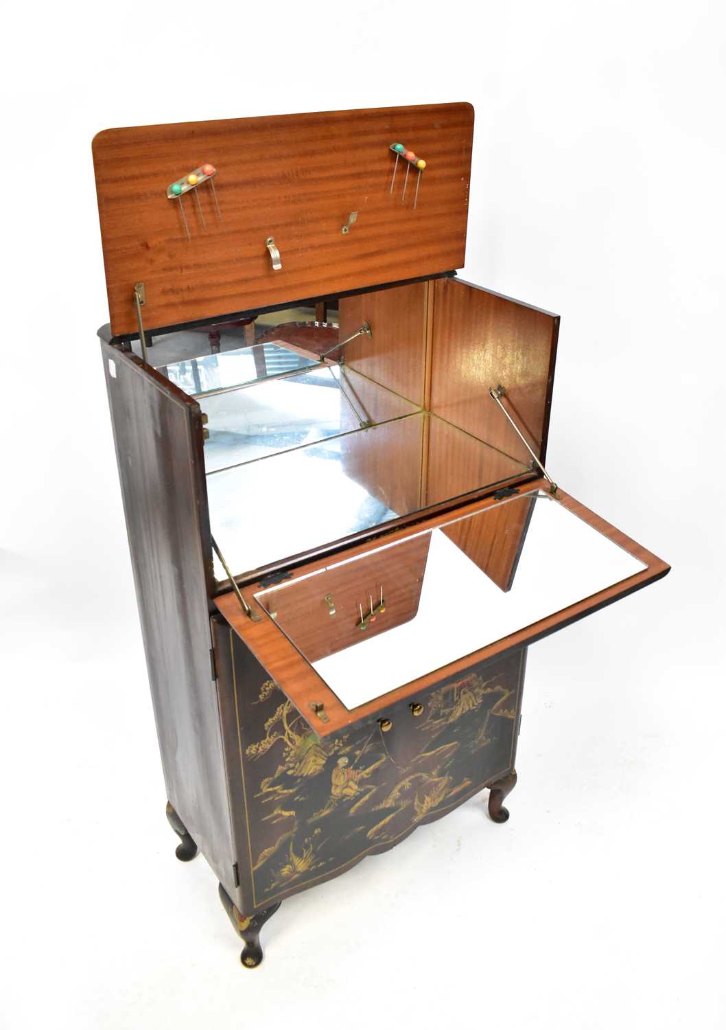 Lot 72 - A mid-20th century cocktail cabinet lacquered...