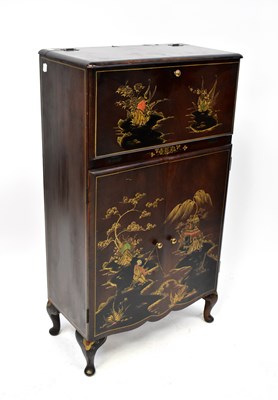 Lot 72 - A mid-20th century cocktail cabinet lacquered...