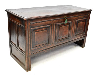 Lot 84 - A Georgian oak coffer, the base with fielded...