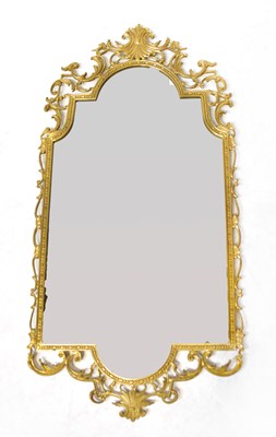 Lot 108 - A gilt metal wall mirror, with arched top and...