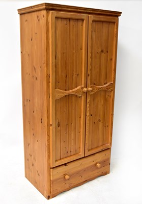 Lot 63 - A 20th century waxed pine four-piece bedroom...