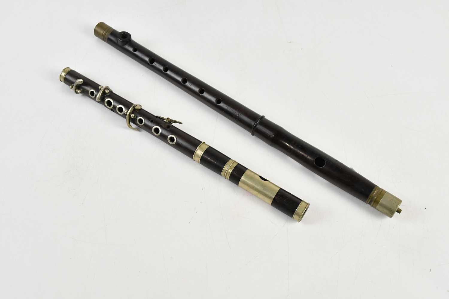 Lot 1598 - G H HULLER; an ebonised piccolo, with further...