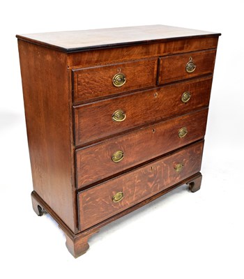 Lot 93 - A George III oak chest of two-over-three...