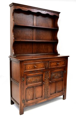 Lot 28 - A reproduction mahogany dome-top dresser on...