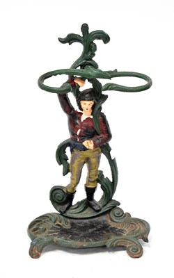 Lot 591 - A painted cast iron figural stick stand in the...