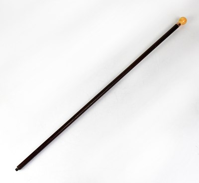 Lot 542 - A bone handled ebonised walking cane with a...