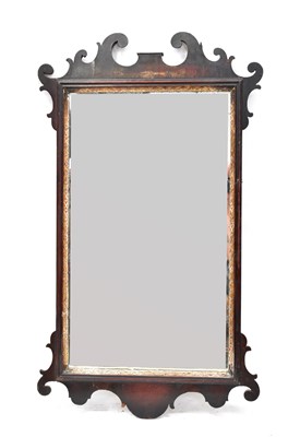 Lot 109 - A Georgian mahogany fret carved mirror with...