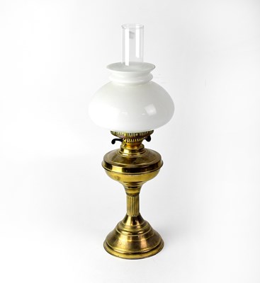 Lot 114 - A brass oil lamp with opaque shade and chimney,...