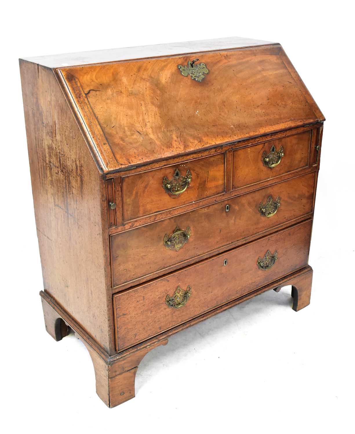 Lot 59 - A George III mahogany bureau, the fall front...