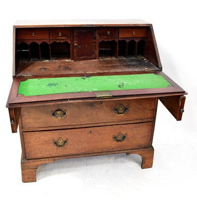 Lot 59 - A George III mahogany bureau, the fall front...