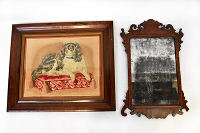 Lot 107 - A Georgian walnut framed fret carved wall...