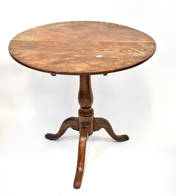 Lot 15 - A Georgian oak tilt-top occasional table...