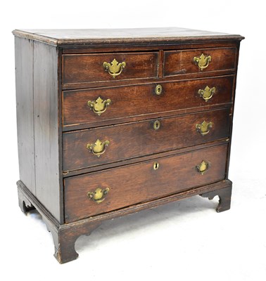 Lot 61 - A Georgian oak chest of two short over three...