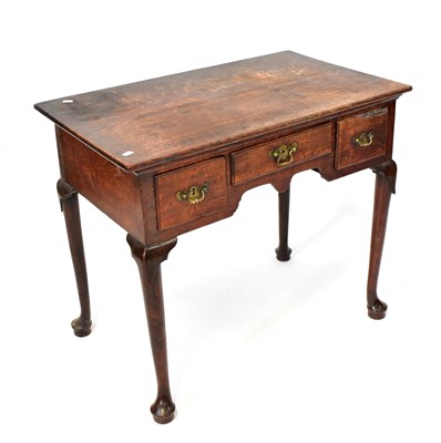 Lot 80 - A Georgian oak lowboy with three frieze...